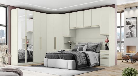 Quarto modulado com guarda-roupa em L, cabeceira e armários aéreos, ilustrando móveis funcionais